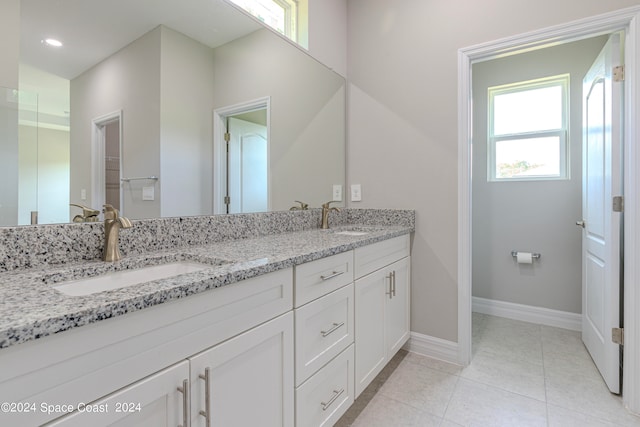 bathroom featuring tile patterned floors and vanity