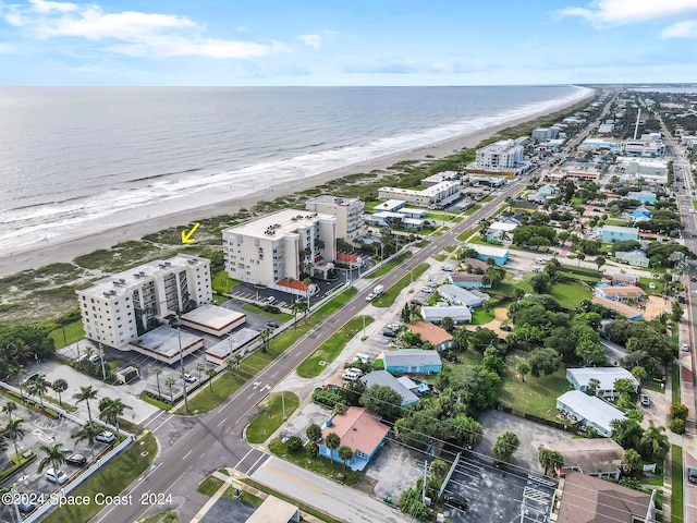 aerial view featuring a view of the beach and a water view