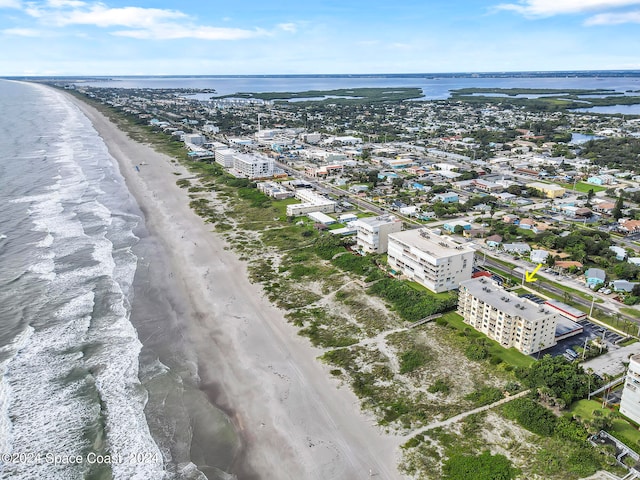 aerial view featuring a water view and a view of the beach