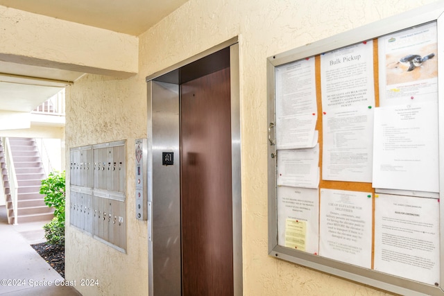 exterior space featuring a mail area and elevator