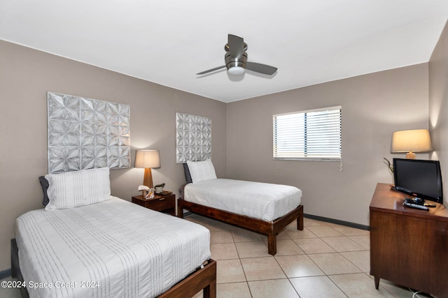 tiled bedroom with ceiling fan