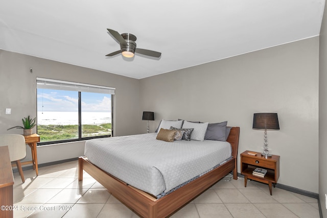 tiled bedroom with ceiling fan