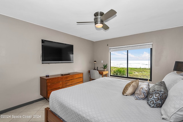 tiled bedroom with ceiling fan