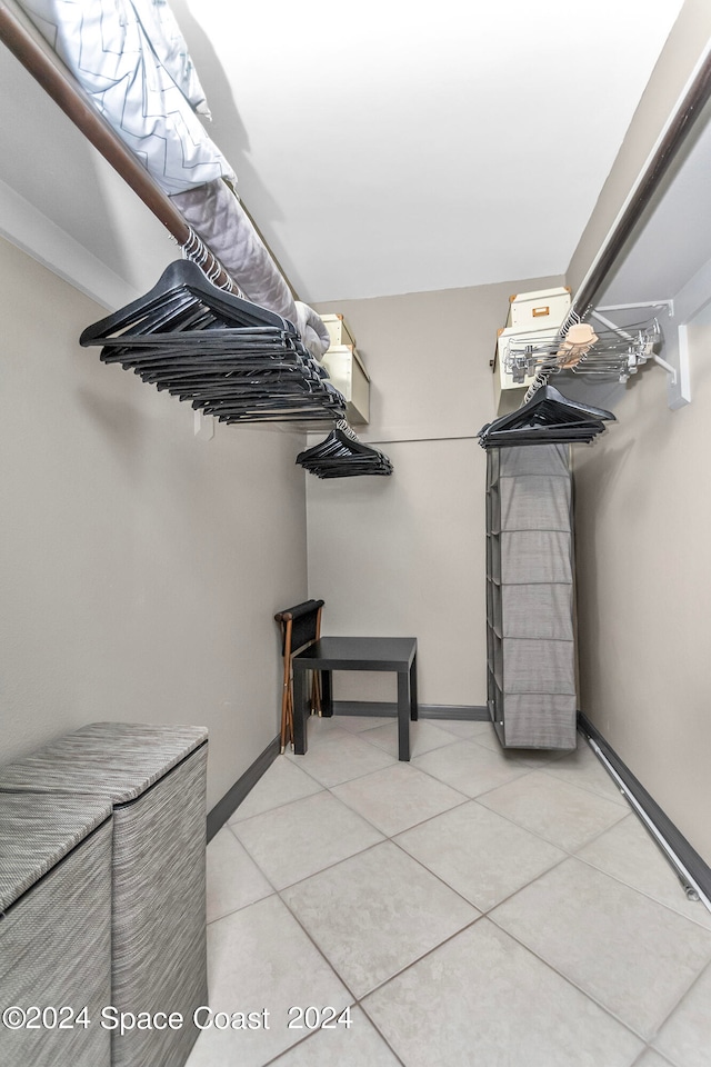 walk in closet featuring light tile patterned floors