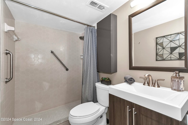 bathroom with a shower with shower curtain, toilet, and vanity