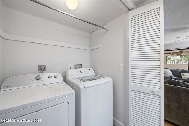 washroom featuring hardwood / wood-style floors and independent washer and dryer