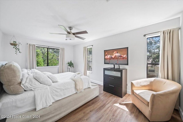 bedroom featuring ceiling fan and wood-type flooring