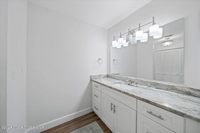 bathroom featuring vanity and wood-type flooring