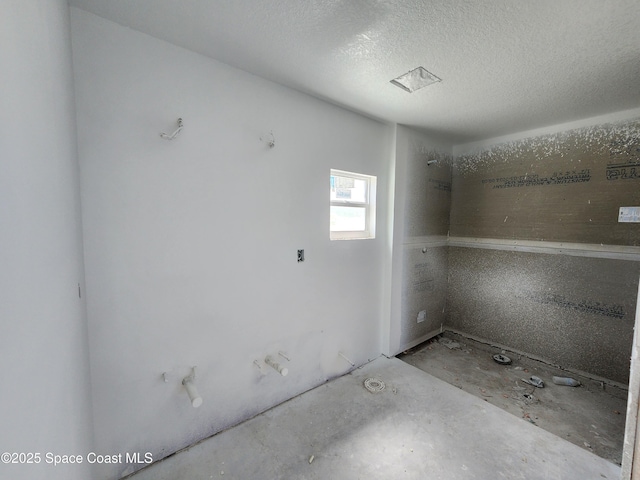 interior space featuring a textured ceiling