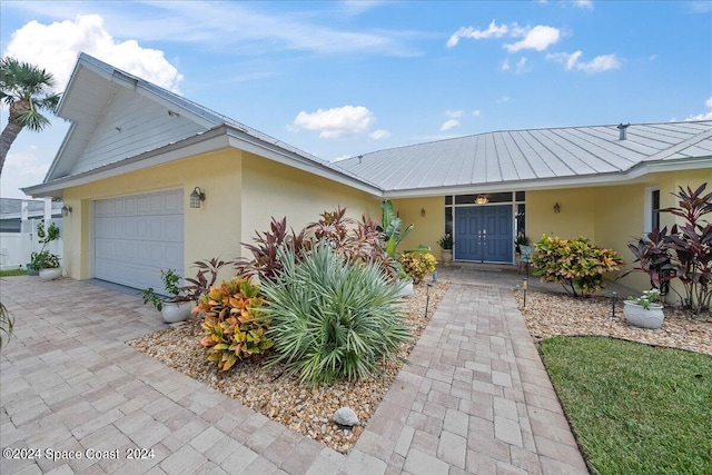 ranch-style home featuring a garage