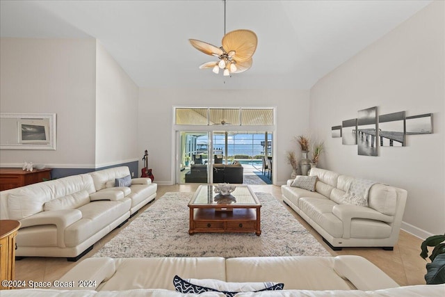 tiled living room with ceiling fan