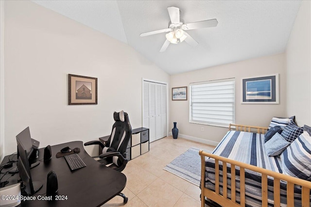 office space featuring lofted ceiling, ceiling fan, and light tile patterned floors