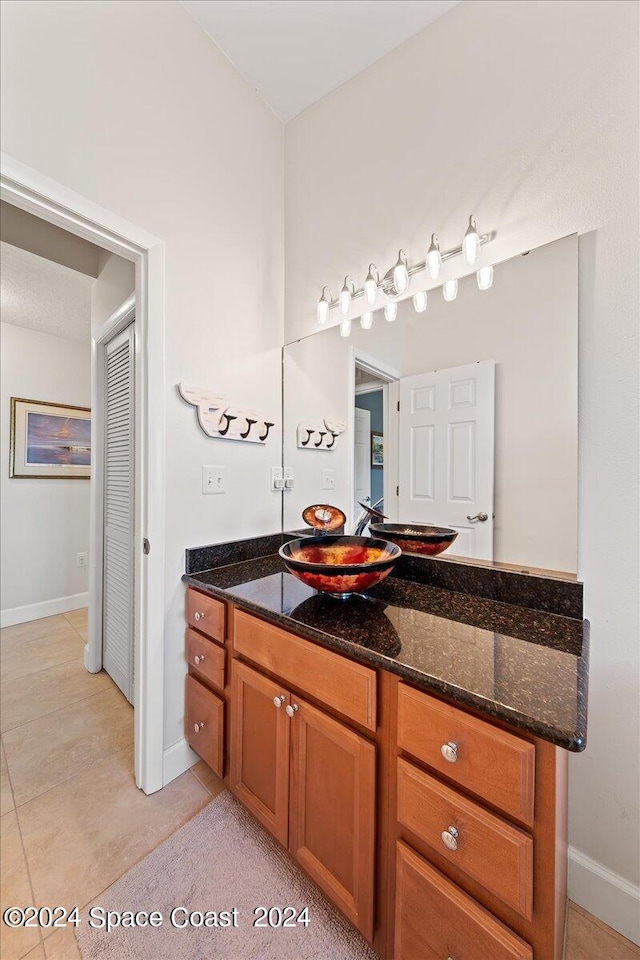 bathroom with vanity and tile patterned floors