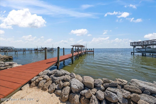 view of dock with a water view