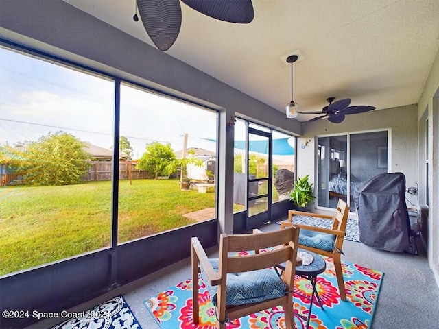 sunroom / solarium with ceiling fan