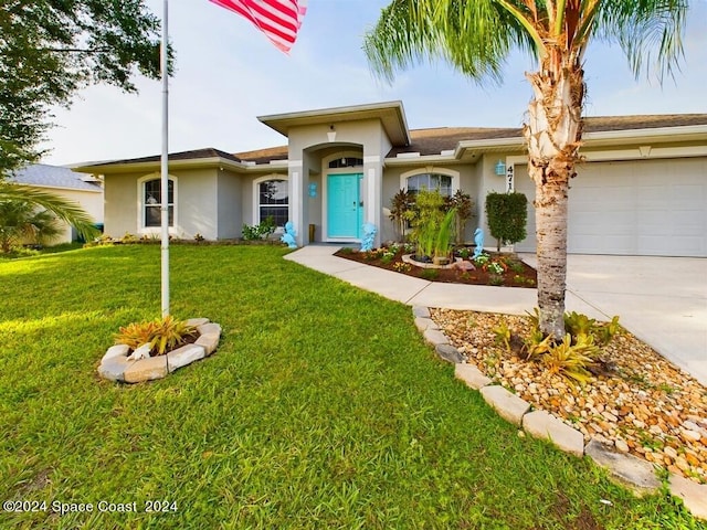 ranch-style house featuring a garage and a front lawn