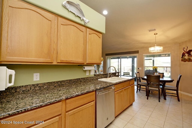 kitchen with dishwasher, sink, light tile patterned floors, decorative light fixtures, and dark stone countertops