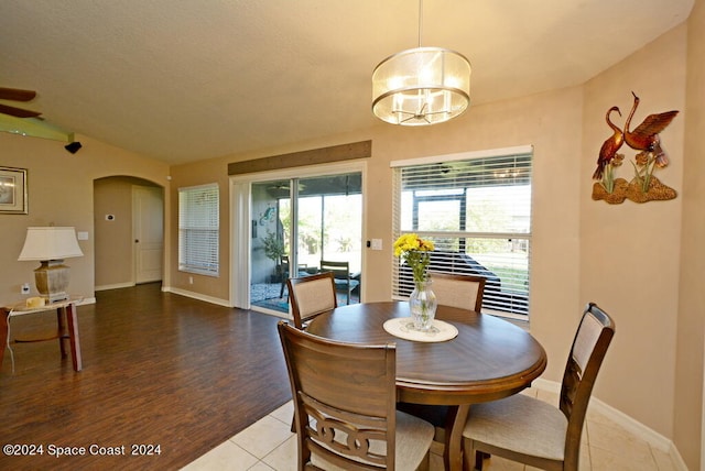 dining room featuring hardwood / wood-style floors and a chandelier