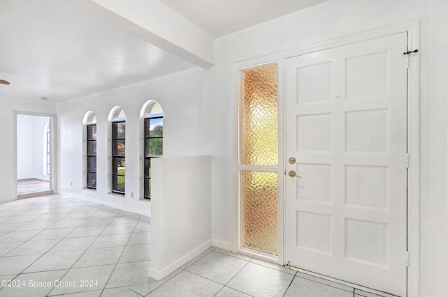 entrance foyer with light tile patterned floors