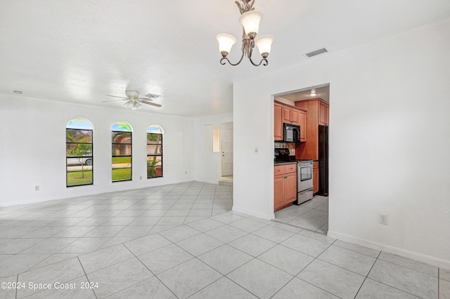 interior space featuring ceiling fan with notable chandelier and light tile patterned flooring