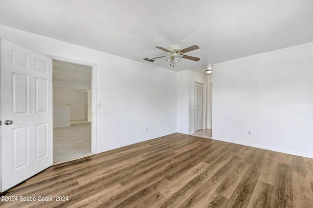 spare room featuring ceiling fan and hardwood / wood-style flooring