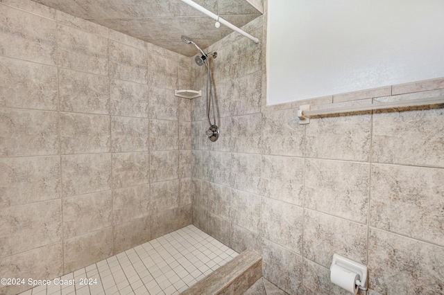 bathroom with a tile shower