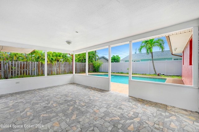 unfurnished sunroom with a wealth of natural light