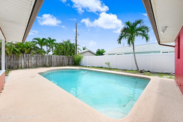 view of swimming pool with a patio