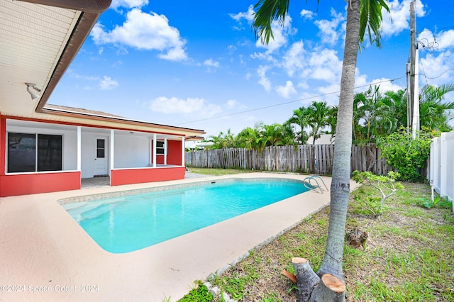 view of pool featuring a fenced in pool, a fenced backyard, and a patio area