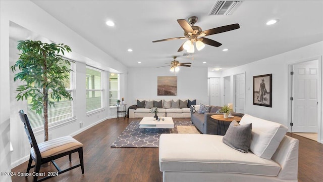 living room with ceiling fan and dark hardwood / wood-style floors