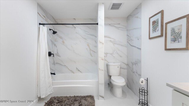 full bathroom with vanity, toilet, and shower / tub combo