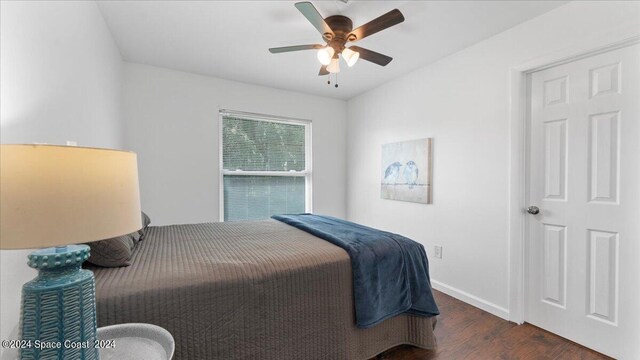 bedroom featuring ceiling fan and dark hardwood / wood-style flooring