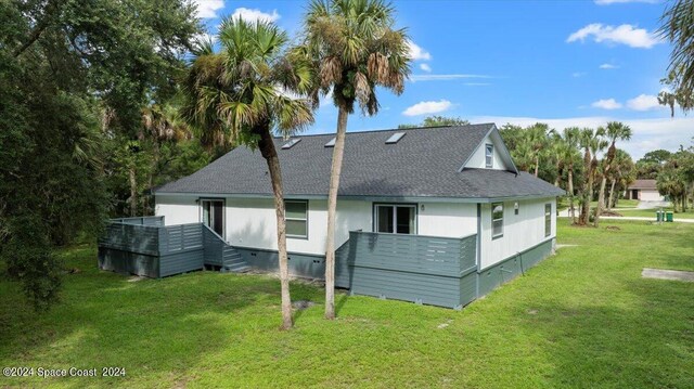 back of house featuring a yard