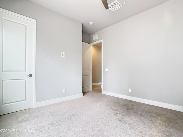 unfurnished bedroom featuring ceiling fan and carpet floors