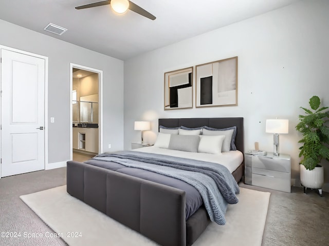 carpeted bedroom featuring ceiling fan and ensuite bathroom