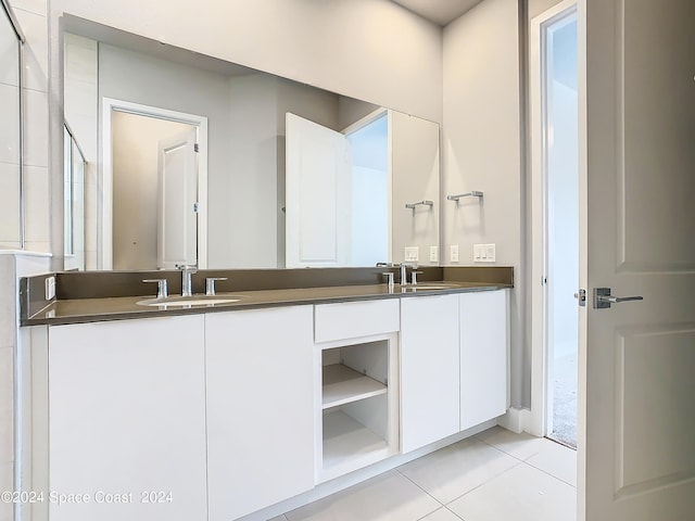 bathroom featuring tile patterned flooring and vanity