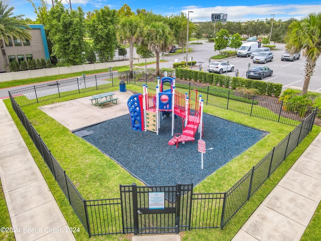 view of playground featuring a lawn