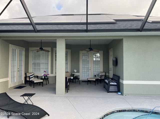 view of swimming pool featuring a patio, a lanai, french doors, and ceiling fan