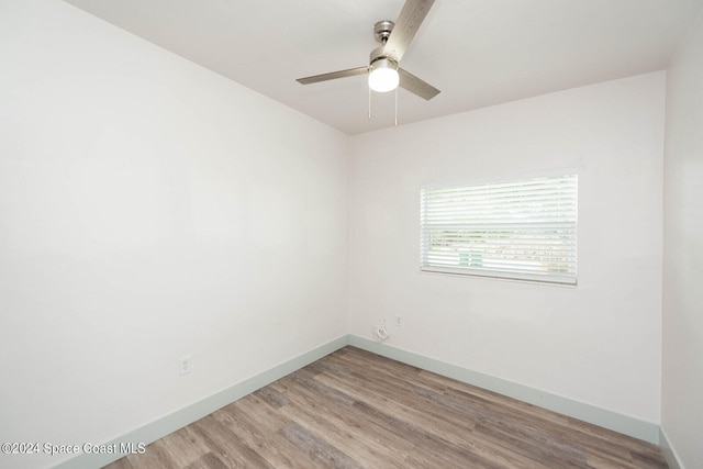 empty room featuring light wood-type flooring and ceiling fan