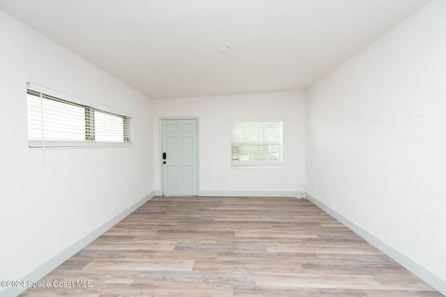 spare room with light wood-type flooring