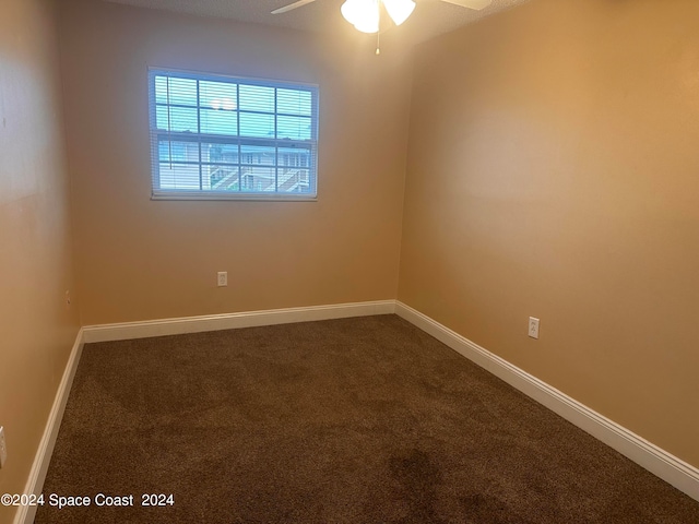 unfurnished room with ceiling fan and carpet floors