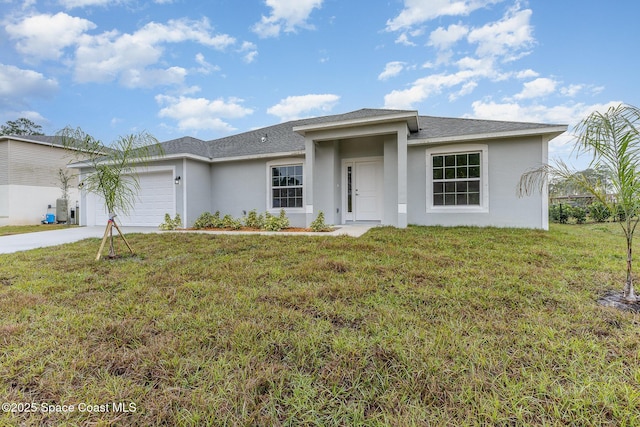 view of front of home with a garage and a front yard