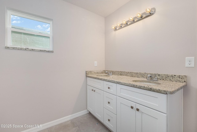 bathroom with tile patterned floors and vanity