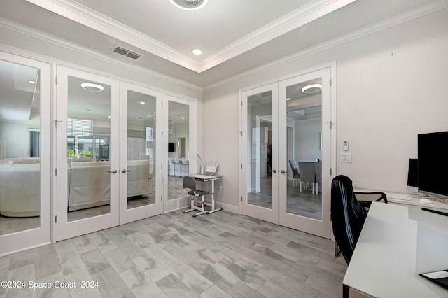 unfurnished office with light wood-type flooring, french doors, and crown molding