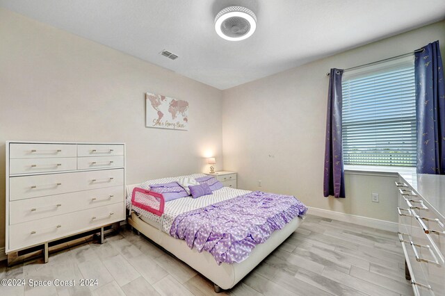 bedroom featuring light hardwood / wood-style flooring