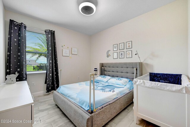 bedroom featuring light wood-type flooring