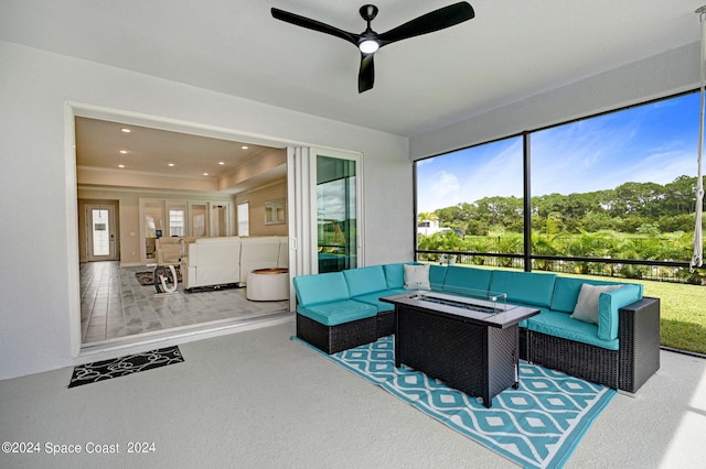 living room with ceiling fan and carpet floors