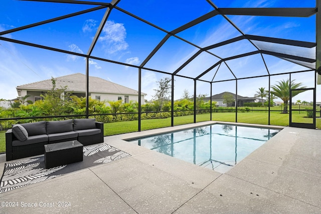 view of pool with a lawn, a patio area, and glass enclosure