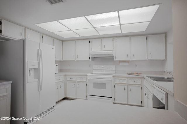 kitchen with white cabinets, white appliances, and sink