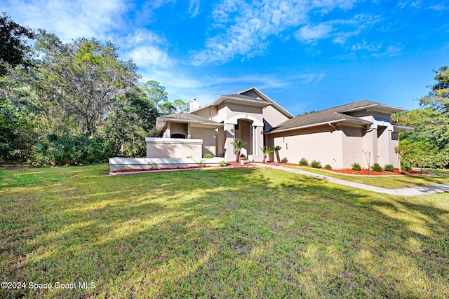 view of front of home with a front lawn